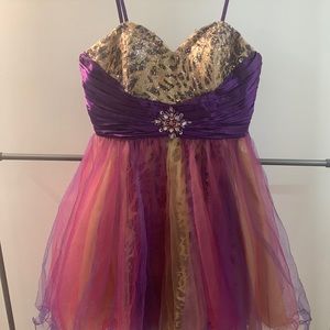 Pink sparkly mini dress with cheetah print accents good for prom or party